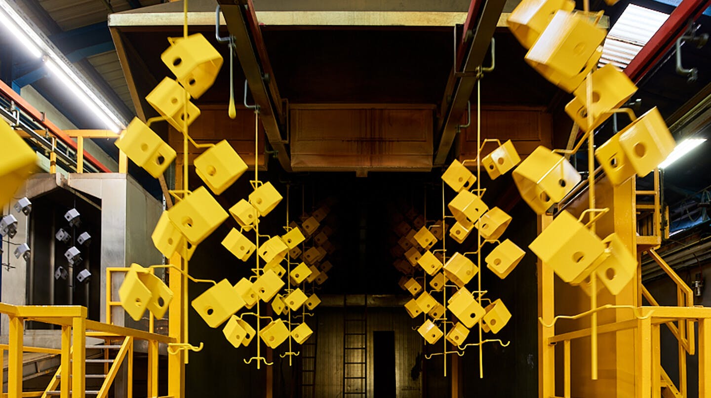 Yellow equipment hanging in a factory